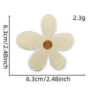 Detailed view of beige floral embroidery patch with 6.3cm size markings and texture