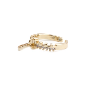 Minimalist gold zipper-shaped open ring with cubic zirconia accents on a clean white backdrop