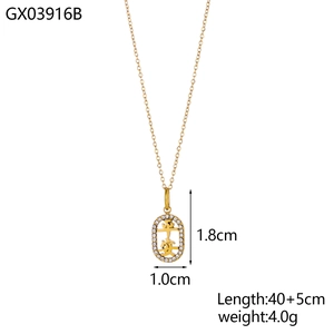 Golden oval pendant necklace with Ping An Chinese characters and pavé set white crystals