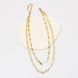 Detail of 18K gold-plated double-layer paperclip and bead chain with adjustable clasp