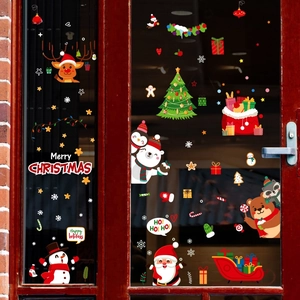 Detail of colorful Christmas window clings with Santa, reindeer and snowman graphics