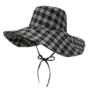 Wide brim black and white checkered sun hat with adjustable bow tie strap for women