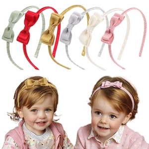 Detailed set of six colorful ribbed fabric bow headbands for toddlers and young girls