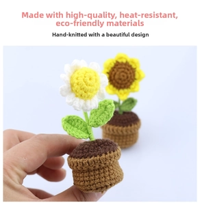 Detailed view of hand-knitted sunflower and white flower bonsai car vent clip accessory