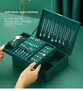 Detail view of emerald velvet jewelry box with 8 necklace hooks and 51 earring slots