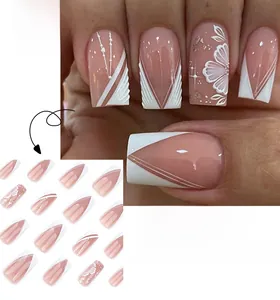 Detail of medium square press-on nails with 3D embossed flowers and gold foil accents