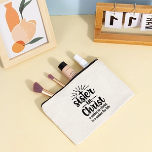 Canvas makeup pouch detail with sister in Christ print showing brushes and cosmetics
