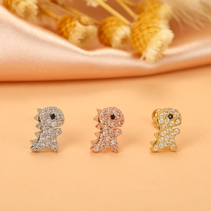 Three dinosaur helix earrings in silver, rose gold, and gold set with shiny zircons