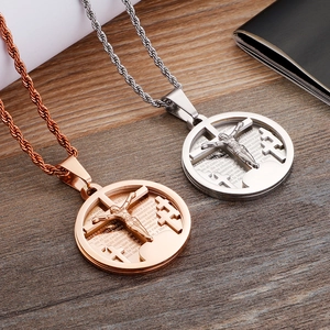 Detail of hip hop cross pendant with Spanish Lord's Prayer engraving on stainless steel
