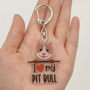 Acrylic Pit Bull keychain with I Heart My Pit Bull text held in hand for size