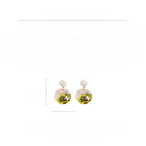 Detailed view of French vintage floral earrings with resin, crystals, and silver needles