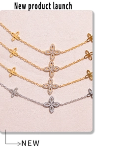 Macro detail of 18K gold plated four-leaf clover necklaces with shimmering zircon crystals