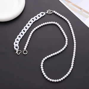 Detail view of white acrylic beads and plastic chain link for DIY phone lanyard straps