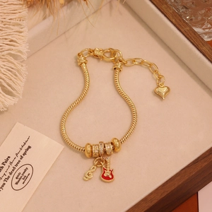 18K gold-plated snake chain bracelet with red guitar and musical note charms