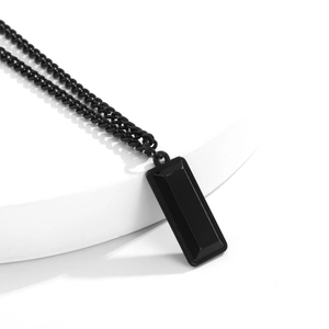 Minimalist black geometric military dog tag pendant necklace on white display stand
