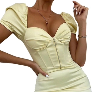 Chic pale yellow satin corset top with puff sleeves and front zipper closure