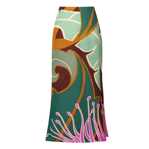 Detail of high-waist maxi skirt featuring a bold abstract floral print in modern colors