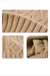 Detail of merino wool knit hat featuring thick cable pattern and ribbed hem edges