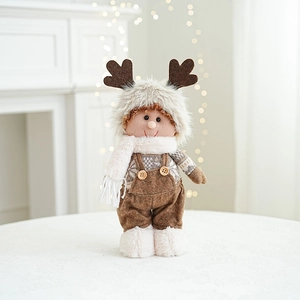Detail of plush Christmas reindeer boy doll with faux fur and wooden button accents