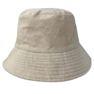 Detailed view of beige terry cloth fabric texture on a classic bucket hat