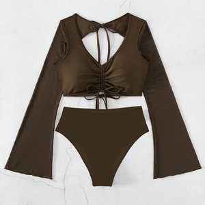 Flat lay detail of dark brown two-piece swimsuit with long flare sleeves and drawstring