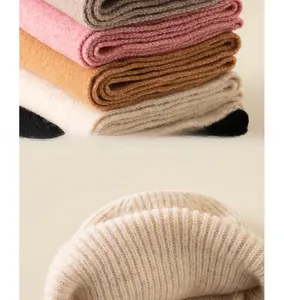 Close-up of ribbed knit texture on soft winter hats in multiple colors for children