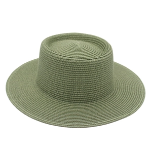 Top-down view showing olive green woven texture of flat top boater straw hat brim