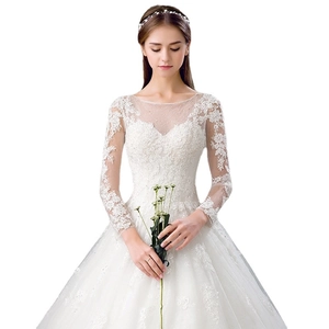 Elegant white lace long sleeve wedding dress with off-shoulder neckline and tulle skirt