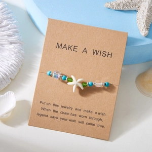 Bohemian starfish beaded bracelet with turquoise stones on a wish card display