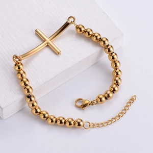 Minimalist gold titanium steel beaded bracelet with horizontal cross charm and lobster clasp