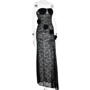 Detail of black lace dress with 3D floral accents and sheer mesh side slit design