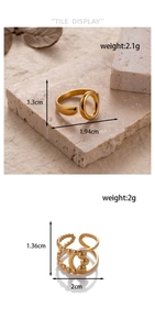 Detail view of gold titanium steel open rings with specific size and weight measurements