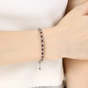 Adjustable silver tennis bracelet with alternating red and white round cubic zirconia stones