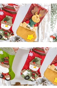 Detail of knitted Christmas stockings featuring 3D Santa, Snowman and Reindeer characters