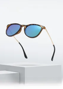 Detail of leopard print oval frames and gold metal temples on children's sunglasses