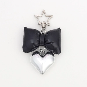 Faux leather black bow keychain with silver heart pendant and star metal clasp