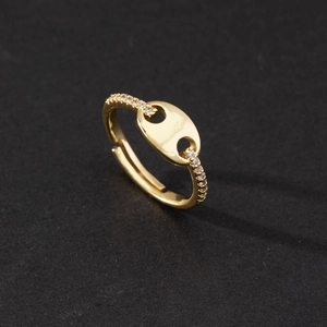 Macro shot of gold zircon pig nose ring showing exquisite diamonds and adjustable opening