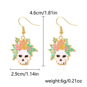 Detail showing dimensions of Halloween skull earrings with pink enamel flowers and gold hooks