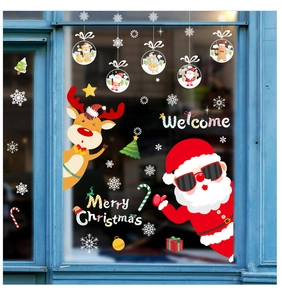 Detail of Christmas window decals with Santa Claus, reindeer, and Merry Christmas text