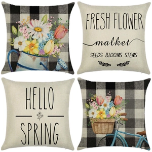 Set of four linen pillow covers featuring floral garden art and spring typography