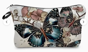 Detail of sunflower and butterfly print on toiletry bag with black zipper close-up