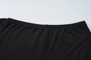 Close-up of the elastic waistband on high-stretch black plus size summer shorts