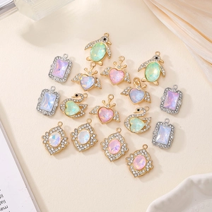 Detail of assorted crystal mocha alloy pendants for DIY necklaces and hair accessories