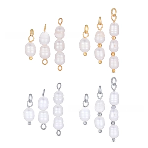 Detailed view of baroque freshwater pearl charms with gold and silver connectors for DIY