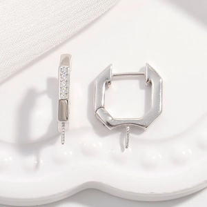 Macro detail of silver S925 hexagonal leverback earrings with pavé zircon for DIY jewelry