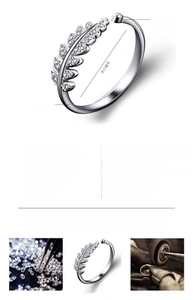 Close-up detail of an adjustable leaf-shaped copper ring featuring sparkling CZ stones