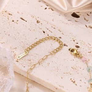 Elegant gold stainless steel bracelet with natural pink and green crushed gemstones