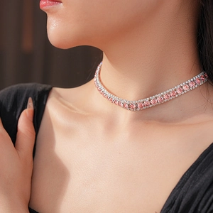 Close-up of pink gemstone choker necklace on neck with silver square diamond setting