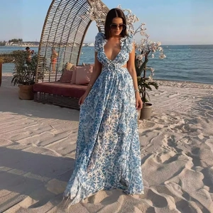 Elegant blue floral maxi dress with waist cut-outs and ruffled details for beach vacations