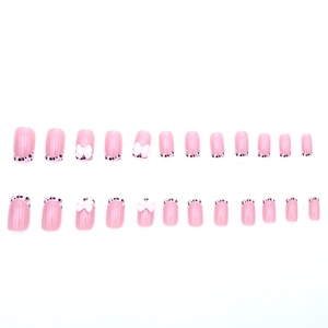 Short french tip press-on nails with leopard print and white 3D butterfly bows